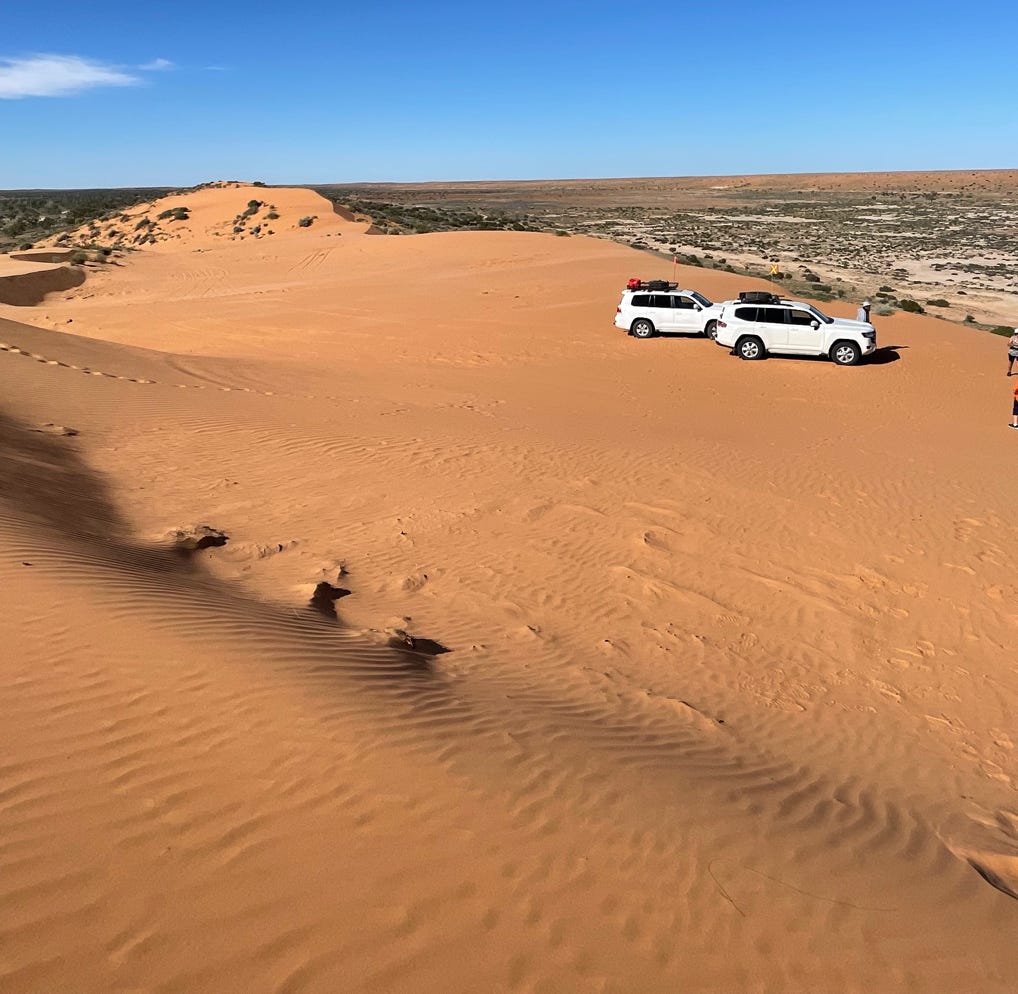 Simpson Desert 4wd vehicles on big Red at the edge of the Simpson ready for a day of Simpson Desert exploring